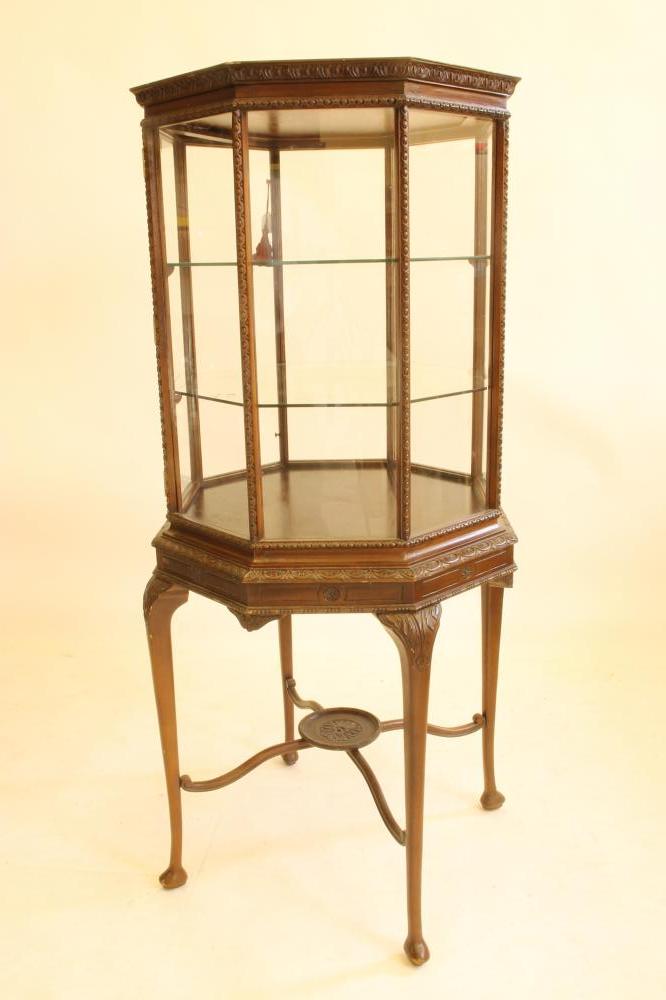 A MAHOGANY DISPLAY CABINET Image