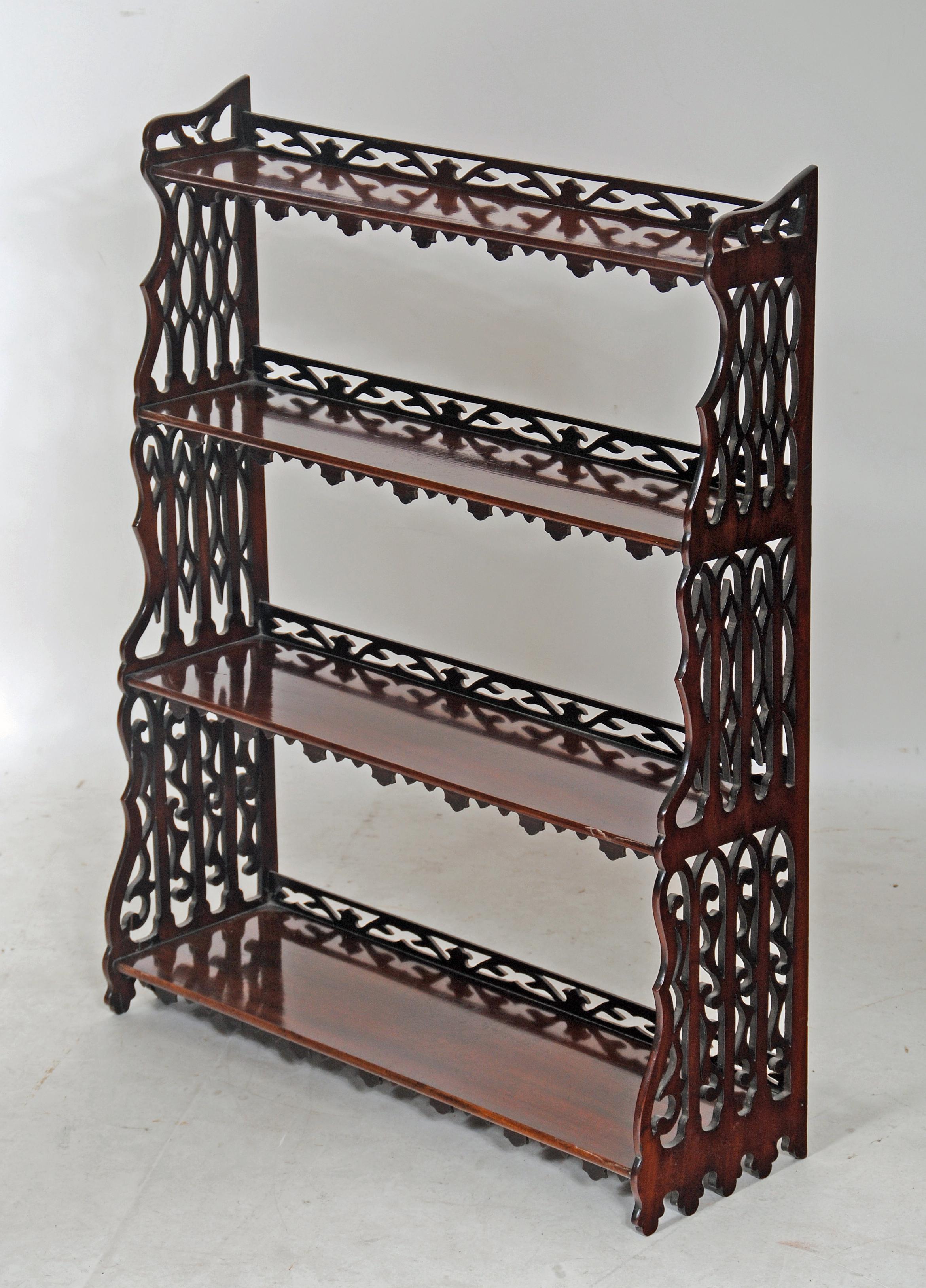 A SET OF GEORGIAN REVIVAL MAHOGANY WALL SHELVES of oblong form Image
