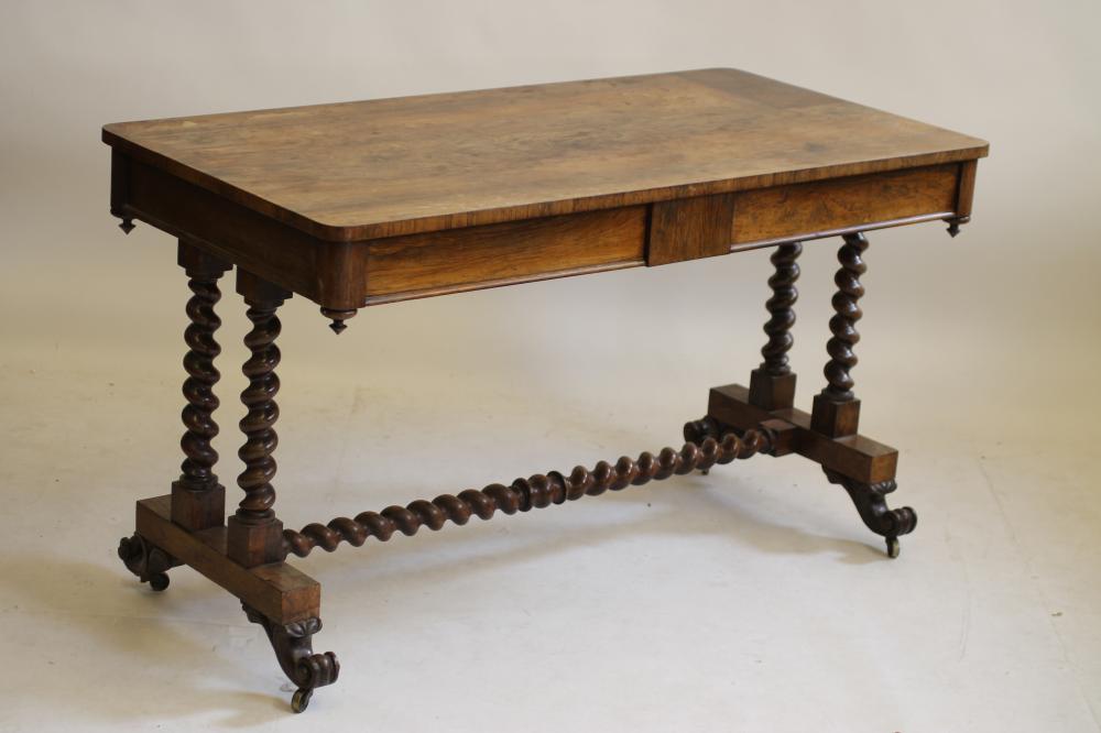 AN EARLY VICTORIAN ROSEWOOD LIBRARY TABLE of rounded oblong pillar end form Image