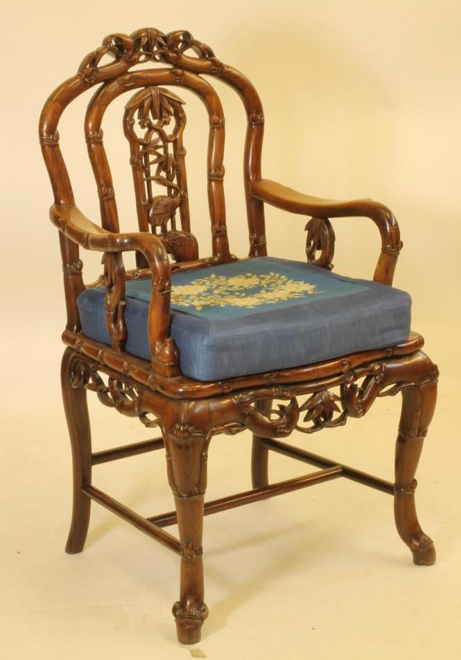 A CHINESE PADOUK ELBOW CHAIR Image