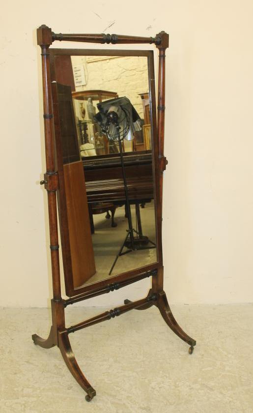 A REGENCY MAHOGANY AND EBONY INLAID CHEVAL MIRROR Image