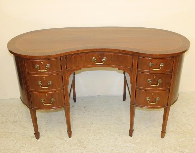 A MAHOGANY AND STRING INLAID KIDNEY SHAPED DESK Image