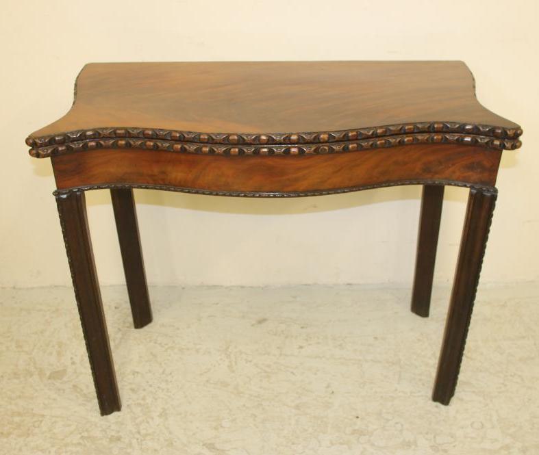 A GEORGIAN MAHOGANY FOLDING TEA TABLE Image