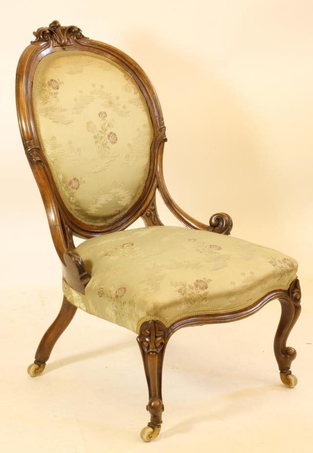A VICTORIAN WALNUT SALON CHAIR upholstered in pale green silk brocade Image