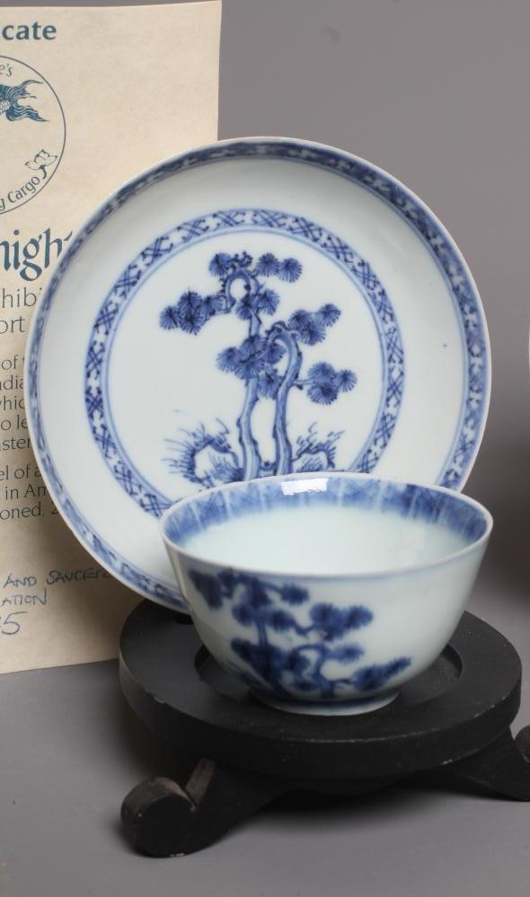 A PAIR OF NANKING CARGO CHINESE PORCELAIN SMALL TEA BOWLS AND SAUCERS each painted with a prunus Image