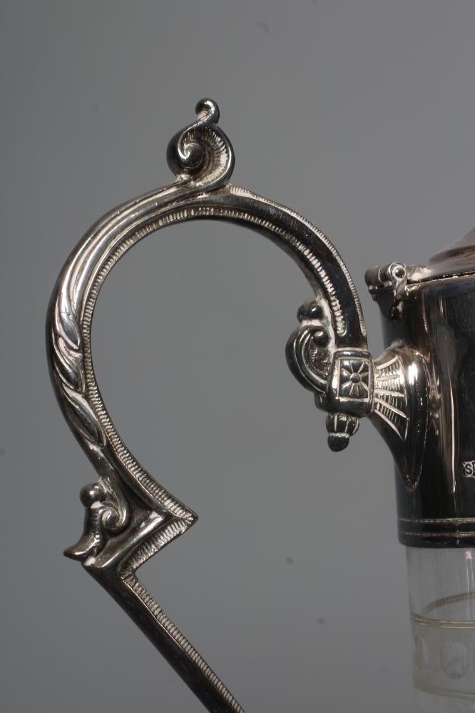 AN ELIZABETH II SILVER MOUNTED GLASS CLARET JUG of swept cylindrical form Image