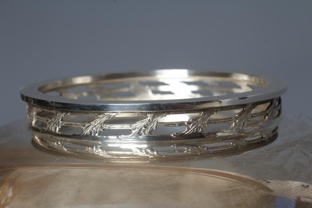 AN ELIZABETH II SILVER BOWL by A E Jones, Birmingham 1995, of plain circular form with pierced and Image