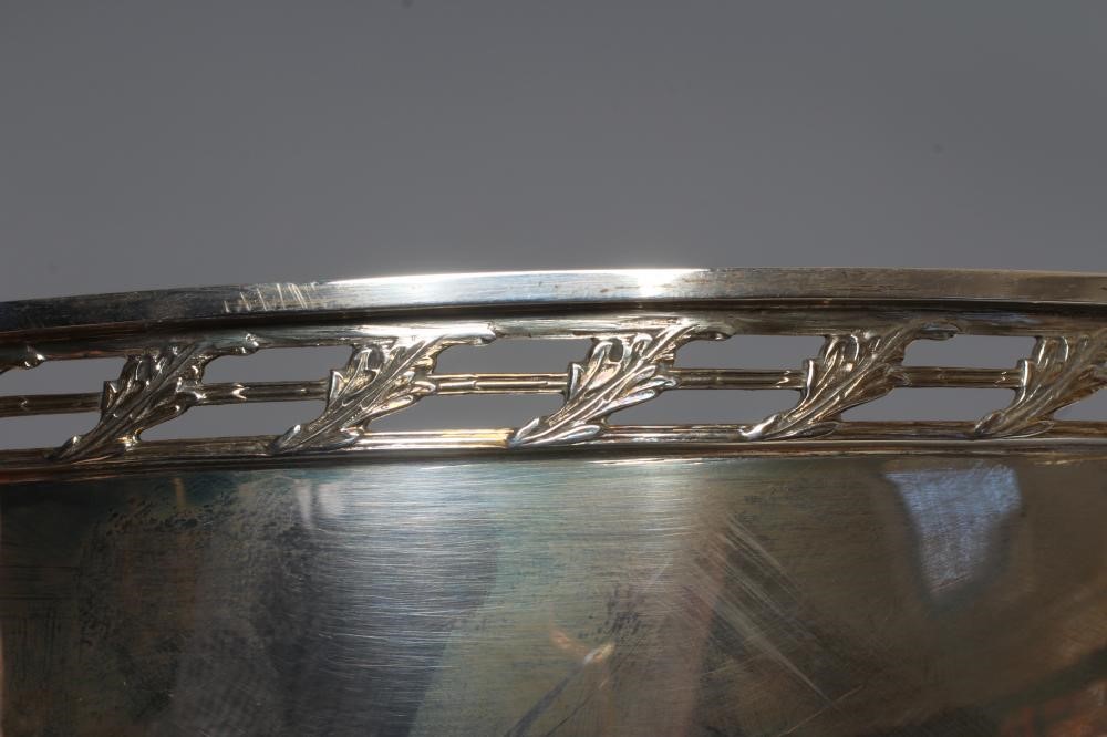 AN ELIZABETH II SILVER BOWL by A E Jones, Birmingham 1995, of plain circular form with pierced and Image