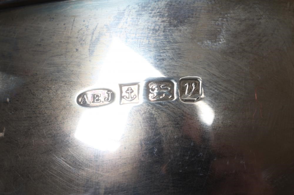 AN ELIZABETH II SILVER BOWL by A E Jones, Birmingham 1995, of plain circular form with pierced and Image