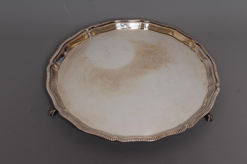 AN ELIZABETH II SILVER SALVER by Mappin & Webb Image