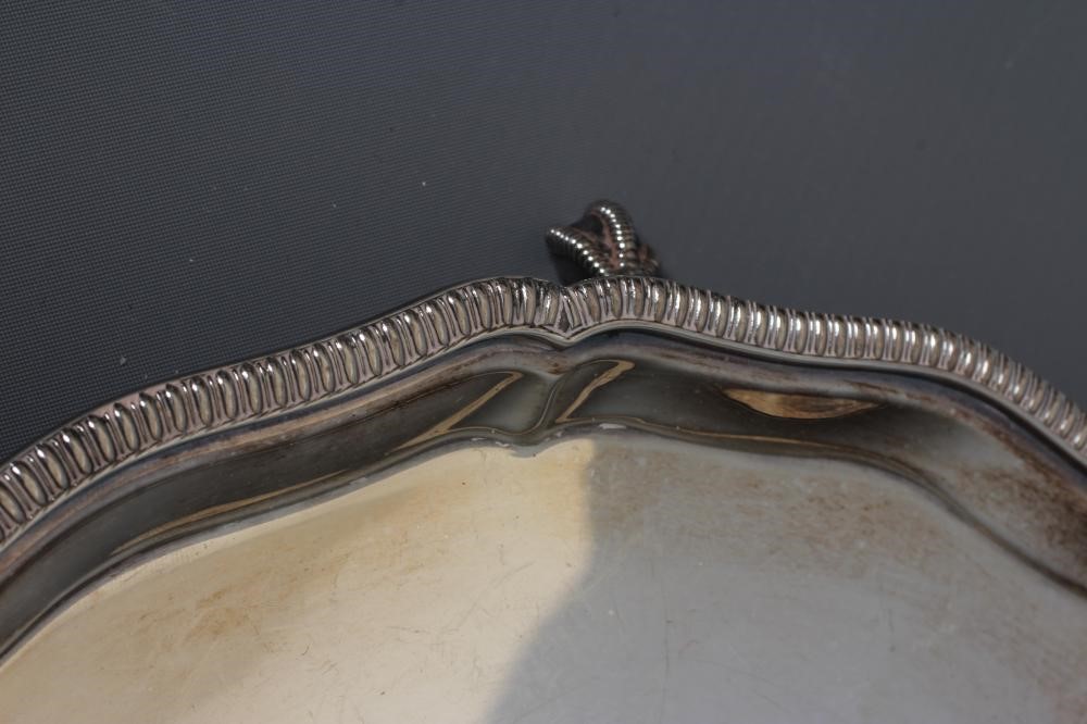 AN ELIZABETH II SILVER SALVER by Mappin & Webb Image