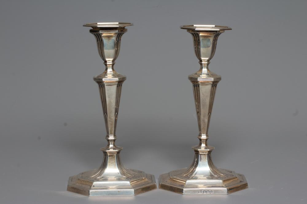 A COMPOSITE PAIR OF GEORGE V SILVER CANDLESTICKS by Harrison Bros. & Howson Image