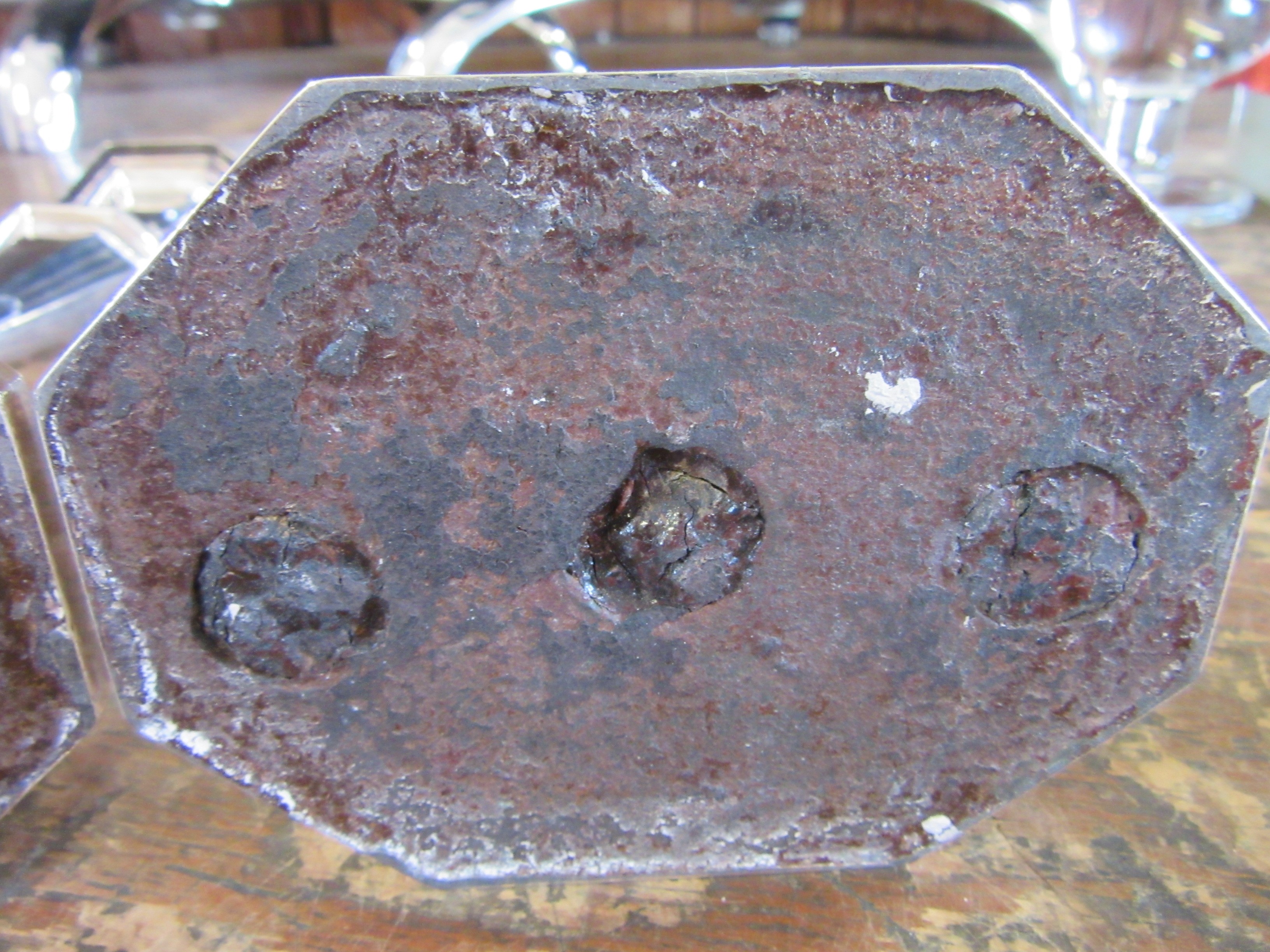 A COMPOSITE PAIR OF GEORGE V SILVER CANDLESTICKS by Harrison Bros. & Howson Image