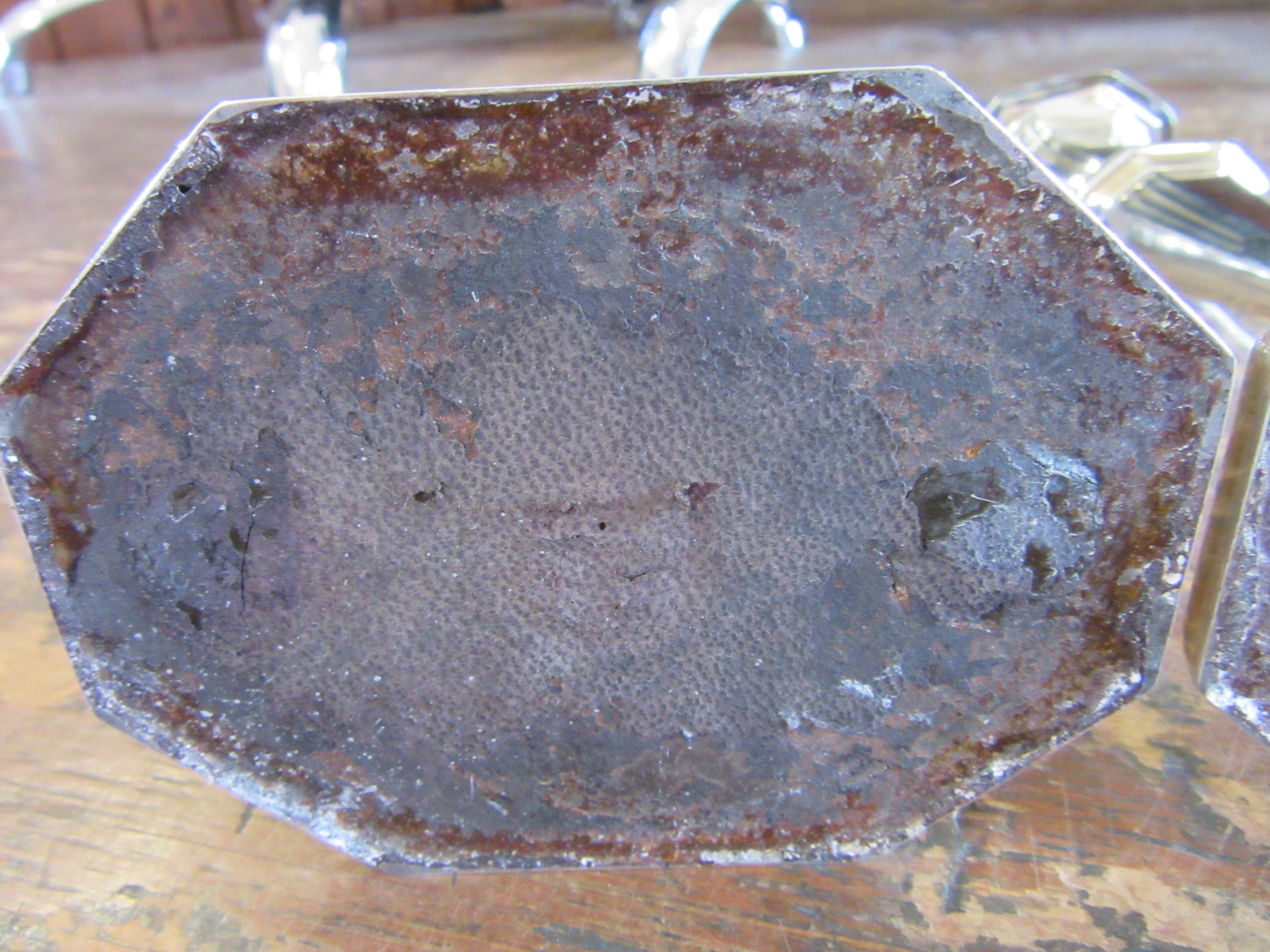 A COMPOSITE PAIR OF GEORGE V SILVER CANDLESTICKS by Harrison Bros. & Howson Image