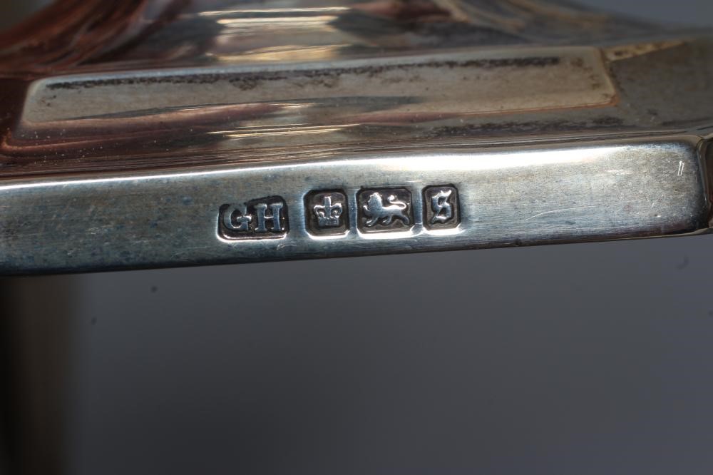 A COMPOSITE PAIR OF GEORGE V SILVER CANDLESTICKS by Harrison Bros. & Howson Image