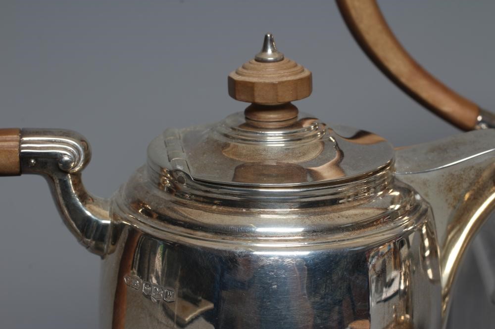A GEORGE VI SILVER FOUR PIECE TEA AND COFFEE SERVICE by Fattorini & Sons Image