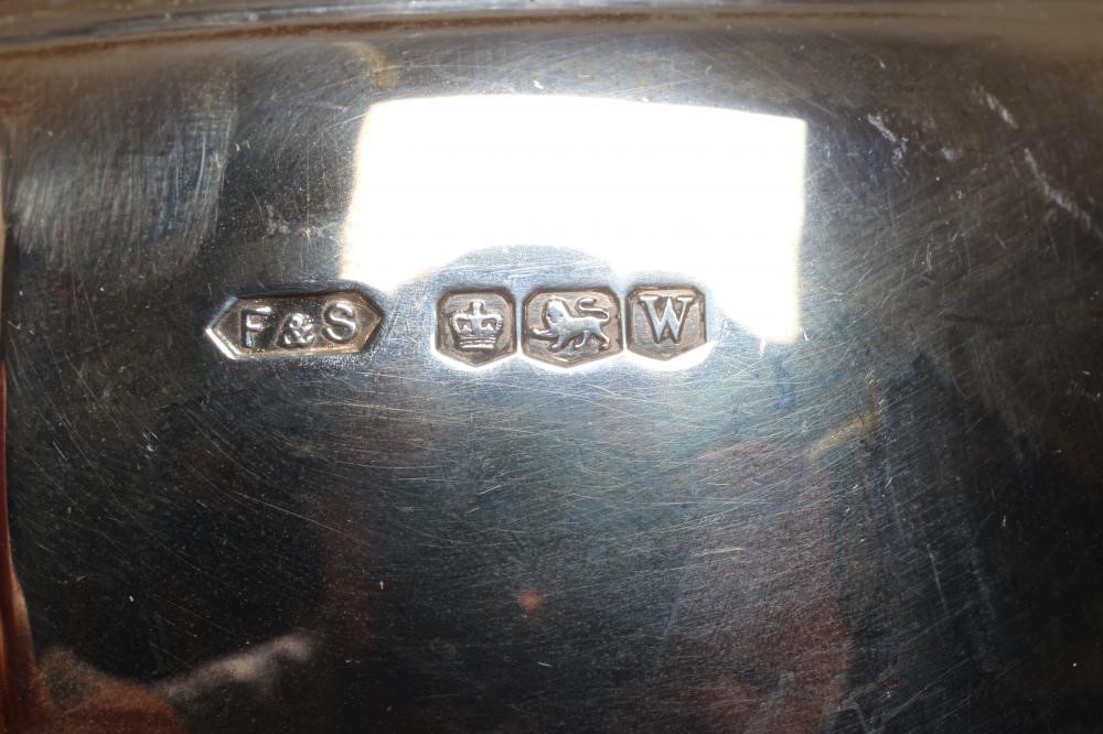 A GEORGE VI SILVER FOUR PIECE TEA AND COFFEE SERVICE by Fattorini & Sons Image