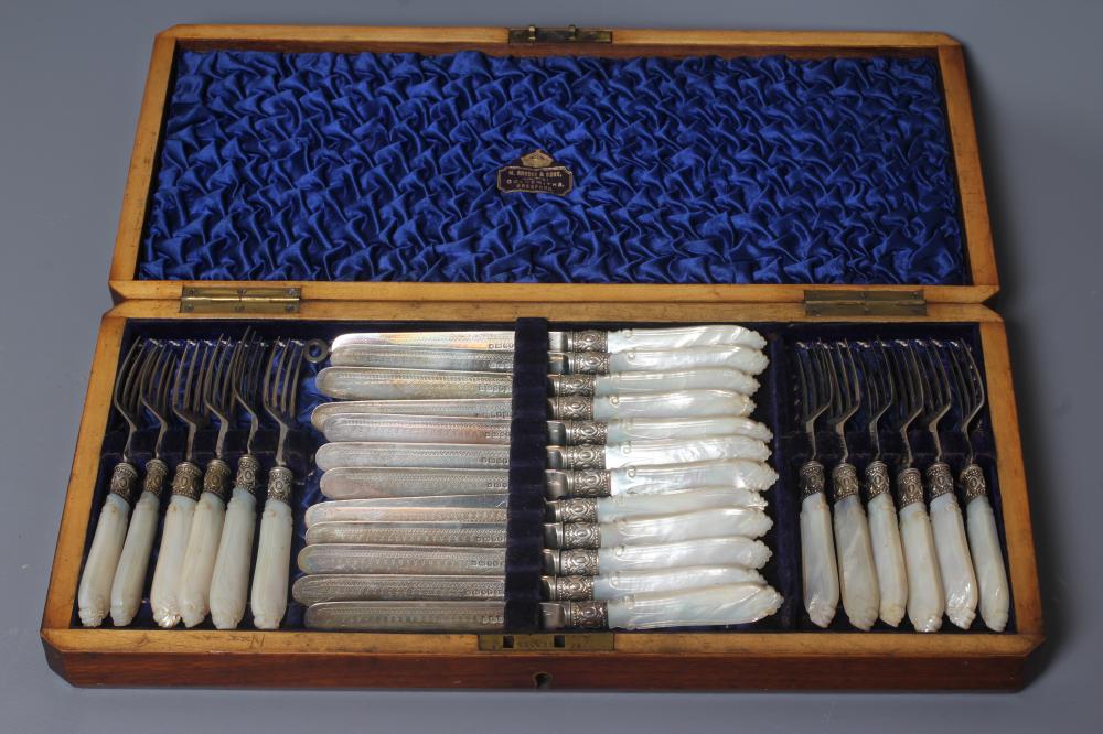 A SET OF TWELVE PAIRS OF VICTORIAN SILVER FRUIT KNIVES AND FORKS by Harrison Bros. & Howson Image