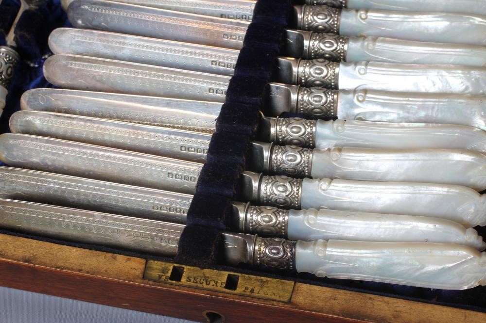 A SET OF TWELVE PAIRS OF VICTORIAN SILVER FRUIT KNIVES AND FORKS by Harrison Bros. & Howson Image