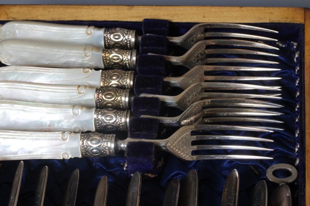 A SET OF TWELVE PAIRS OF VICTORIAN SILVER FRUIT KNIVES AND FORKS by Harrison Bros. & Howson Image