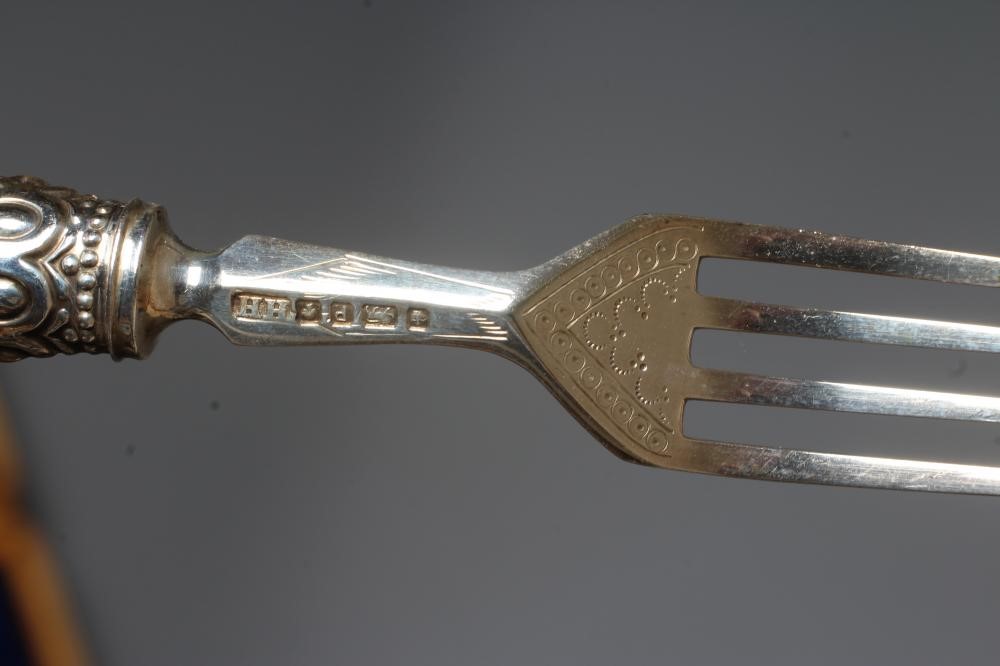 A SET OF TWELVE PAIRS OF VICTORIAN SILVER FRUIT KNIVES AND FORKS by Harrison Bros. & Howson Image
