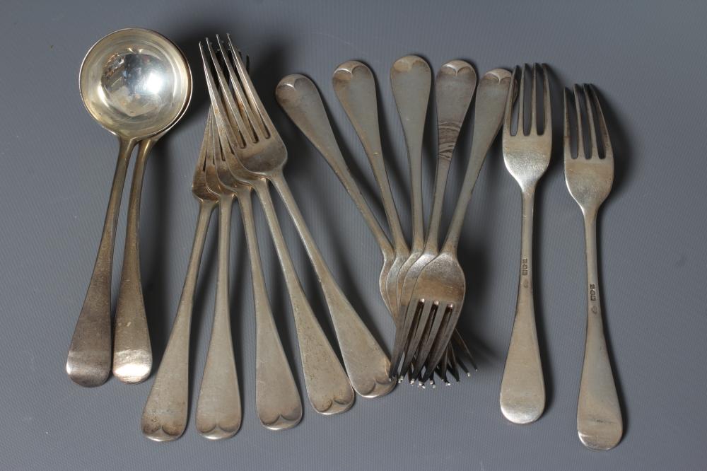 A SET OF TWELVE EDWARDIAN SILVER HANOVERIAN PATTERN TABLE FORKS by Goldsmiths and Silversmiths Ltd. Image