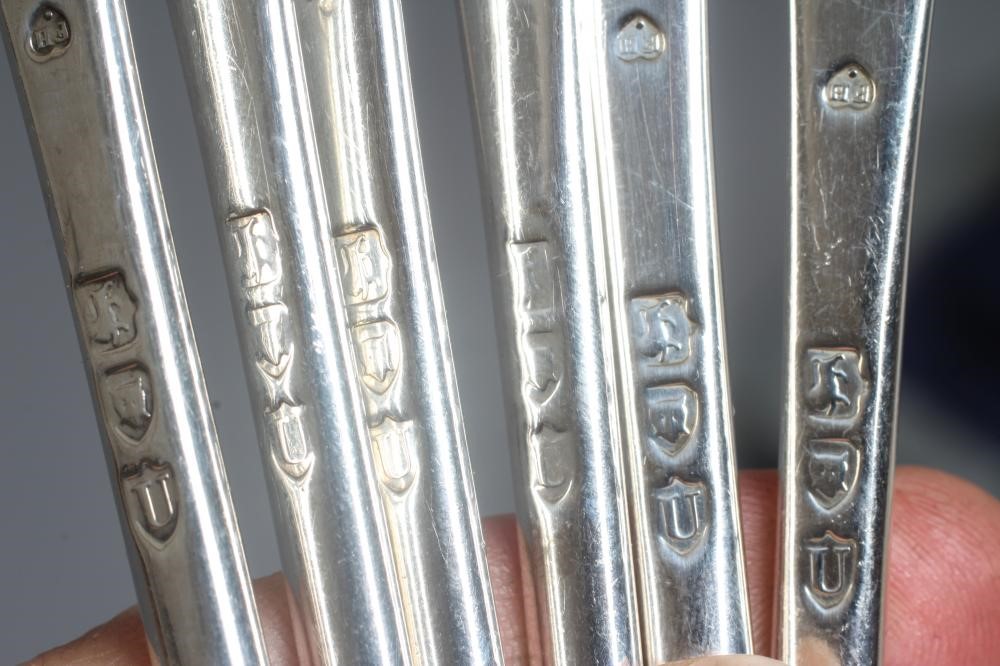 A SET OF TWELVE LATE VICTORIAN SILVER SHELL PATTERN TABLE SPOONS AND DESSERT SPOONS AND FORKS by Image