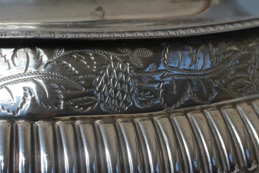 A GEORGE III SILVER TEAPOT Image