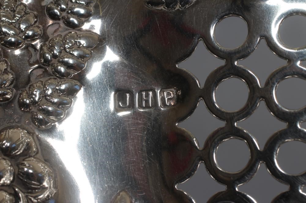 AN EDWARDIAN SILVER BASKET by John Henry Potter Image