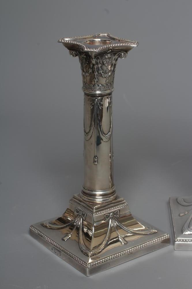 A PAIR OF EDWARDIAN SILVER SMALL CORINTHIAN COLUMN CANDLESTICKS by Thomas Bradbury Image