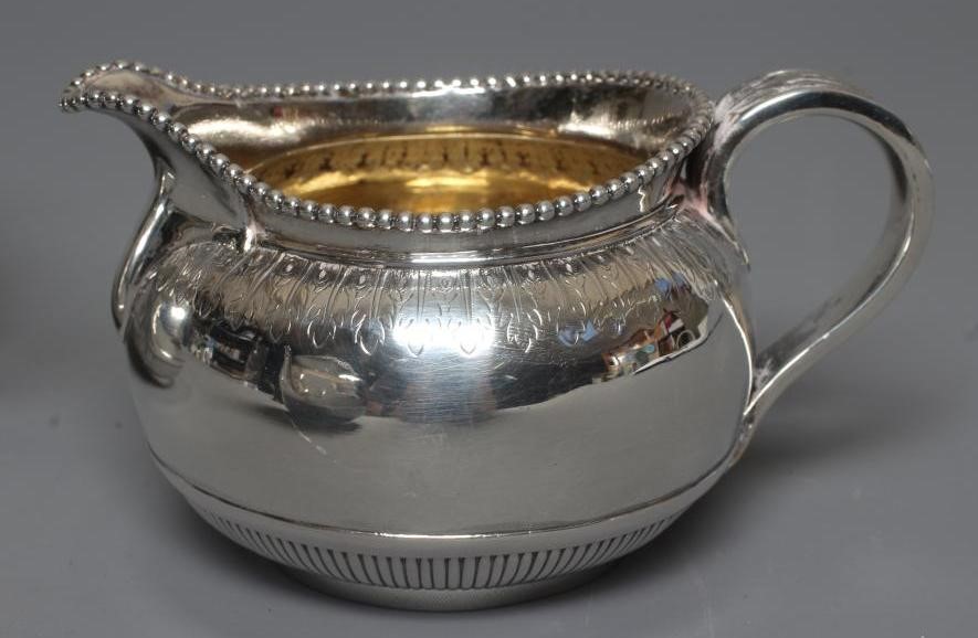 A COMPOSITE VICTORIAN/EDWARDIAN SILVER BACHELOR'S THREE PIECE TEA SERVICE by George Fox Image
