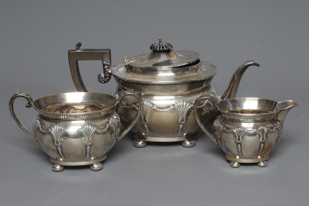AN EDWARDIAN SILVER THREE PIECE TEA SERVICE by Sanders & Hill Image