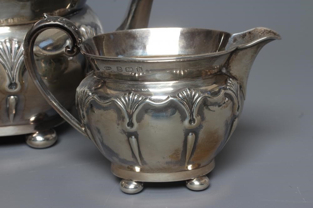 AN EDWARDIAN SILVER THREE PIECE TEA SERVICE by Sanders & Hill Image