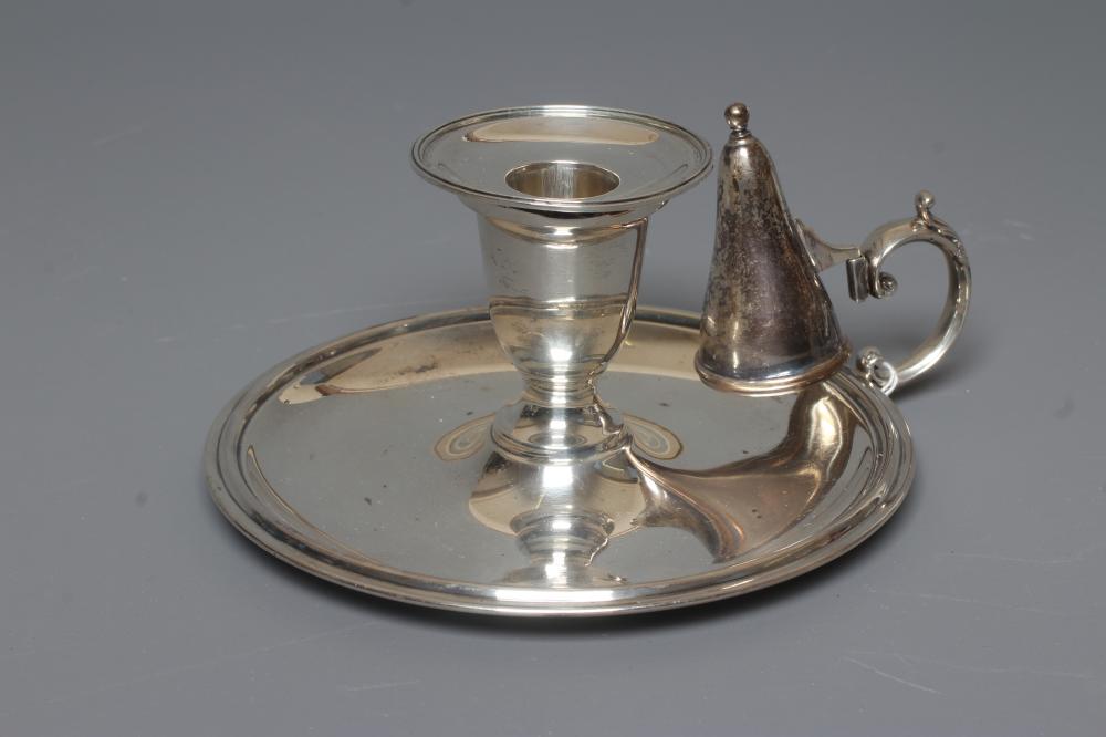 AN EDWARDIAN SILVER CHAMBERSTICK by William Hutton & Sons Ltd. Image
