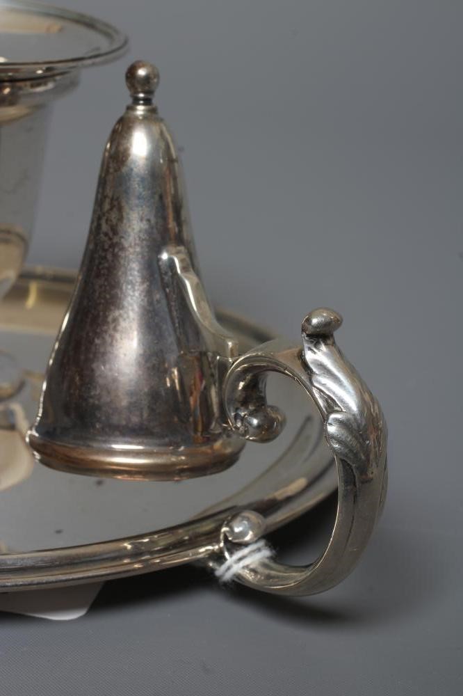AN EDWARDIAN SILVER CHAMBERSTICK by William Hutton & Sons Ltd. Image