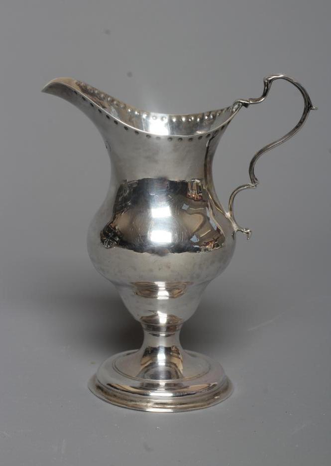 A GEORGE III SILVER JUG probably by Charles Hougham Image