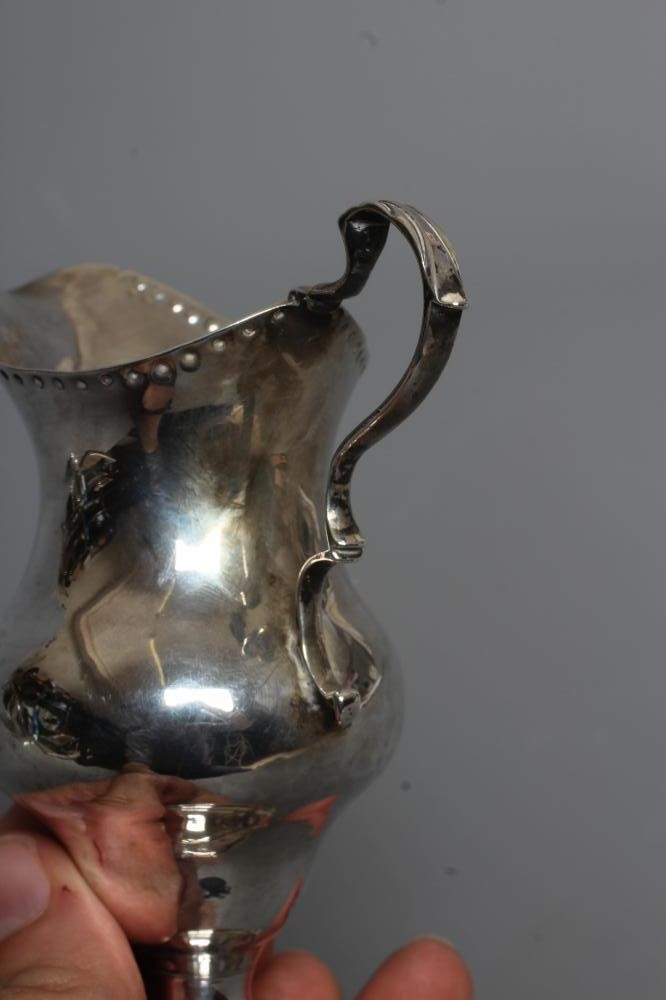 A GEORGE III SILVER JUG probably by Charles Hougham Image