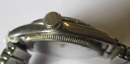 A ROLEX JUNIOR OYSTER WRISTWATCH, the white dial with applied gilt metal Arabic even numerals, in a Image