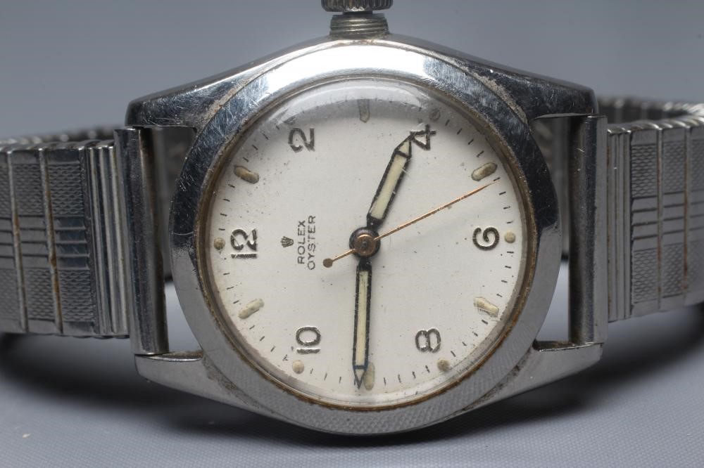 A ROLEX JUNIOR OYSTER WRISTWATCH, the white dial with applied gilt metal Arabic even numerals, in a Image