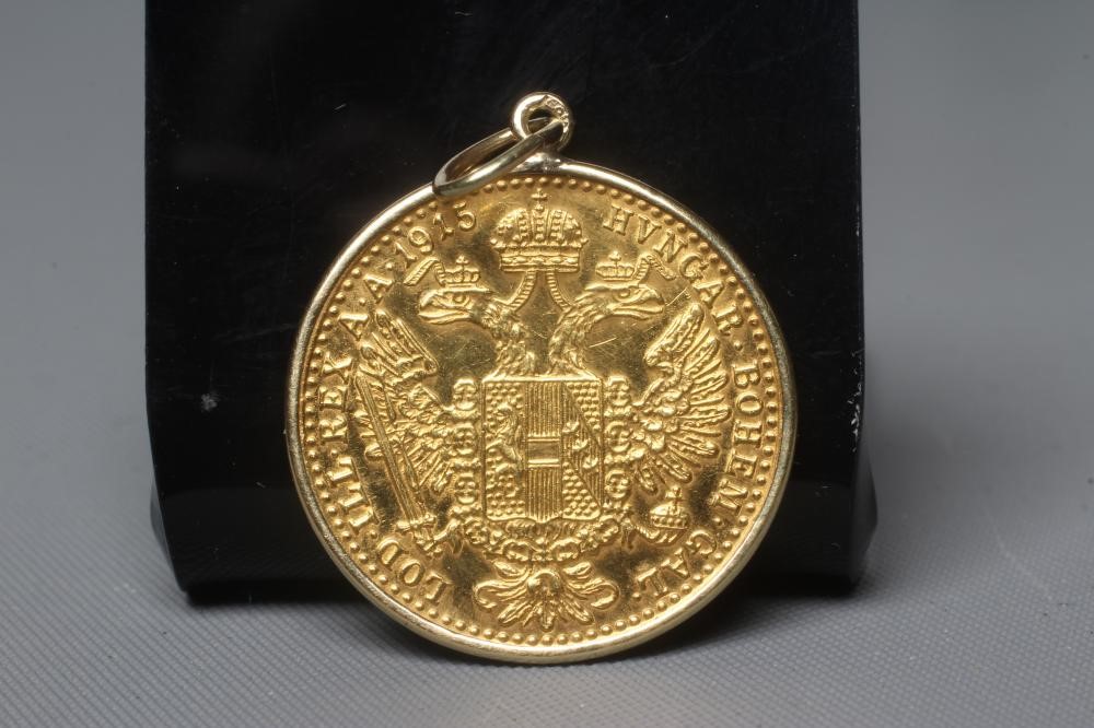 A 1915 RE-STRIKE AUSTRO-HUNGARIAN DUCAT in 14ct gold loose mount, 3.8g gross (Est. plus 24% premium Image