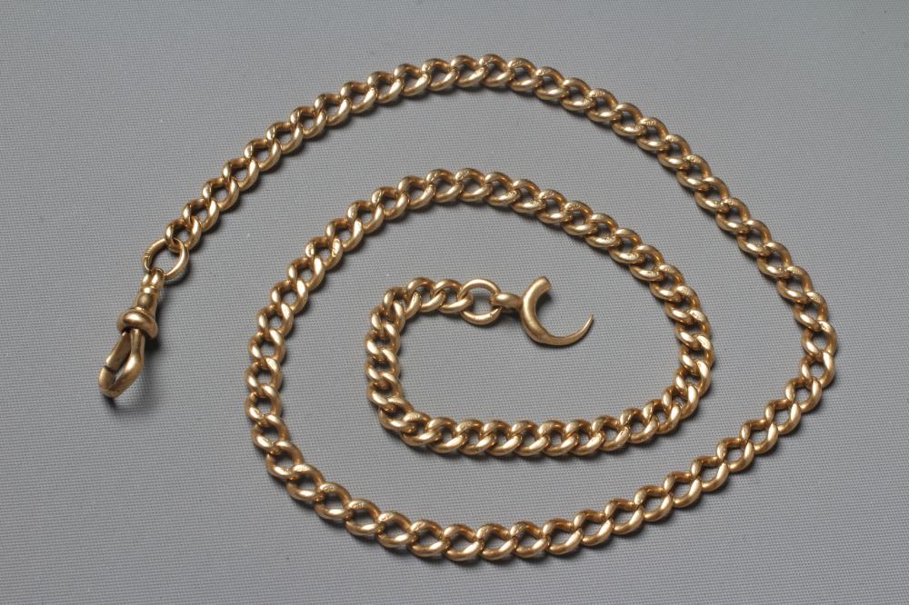 AN 18CT GOLD ALBERT CHAIN, each of the graduating curb links stamped with a crown and 18, with dog Image