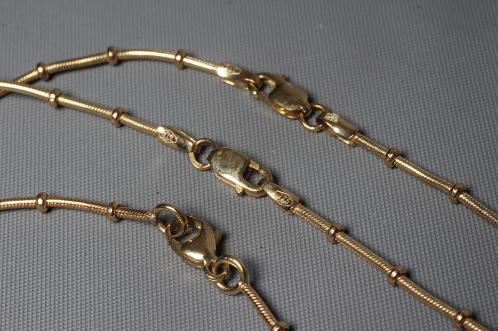 TWO MATCHING CHAIN NECKLACES AND A BRACELET stamped 375, each herringbone type chain with multiple Image