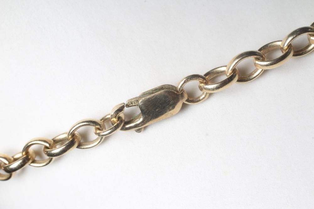 A LARGE INITIAL S PENDANT, tested to 14ct gold but unmarked, fixed to a 9ct gold belcher link chain Image