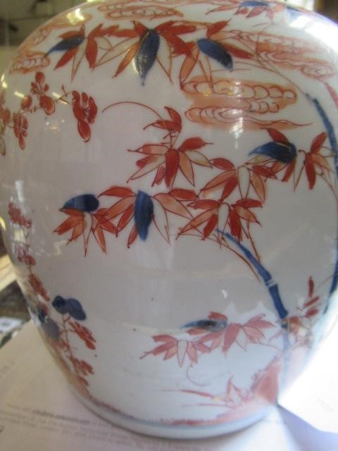 A CHINESE IMARI PORCELAIN JAR painted in underglaze blue and over painted in iron red and burnt Image