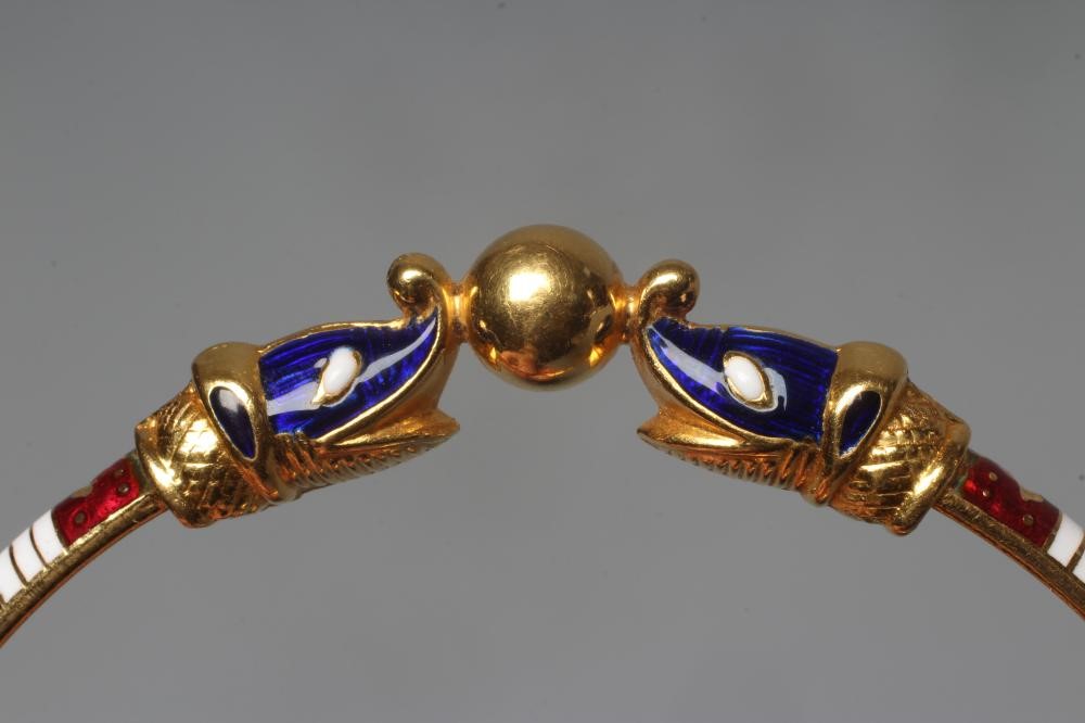A BANGLE, unmarked but similar to previous lot with red, white and green enamelled arcading and Image