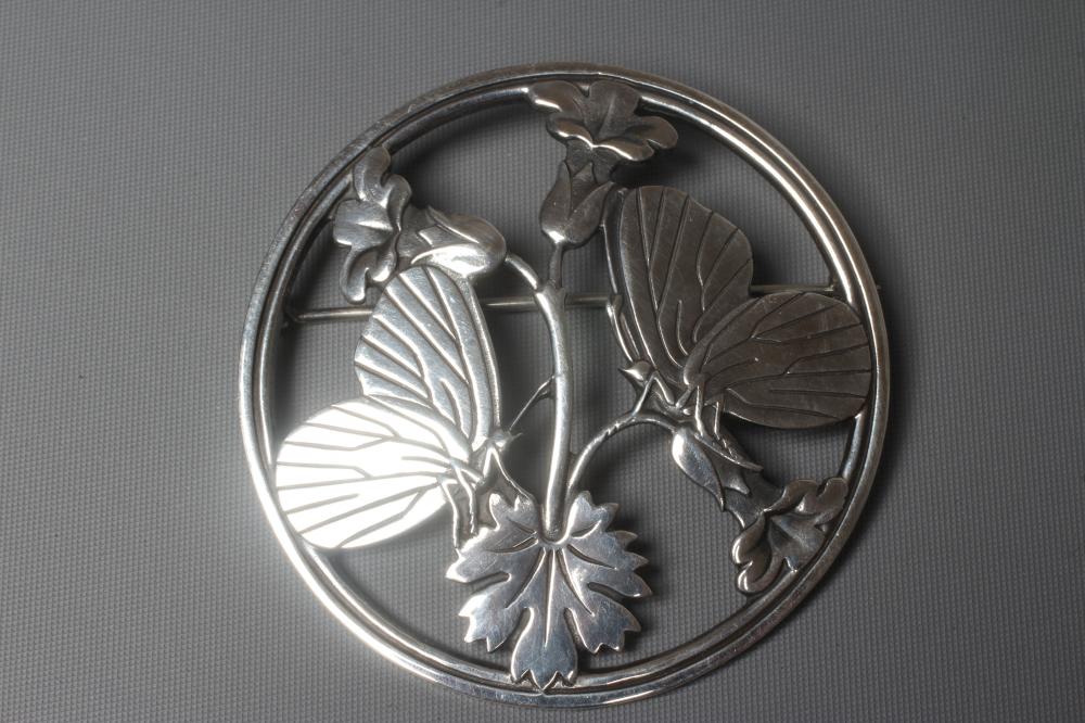 A GEORG JENSEN SILVER CIRCULAR MOONLIGHT BLOSSOM BROOCH designed by Arno Malinowski with two Image