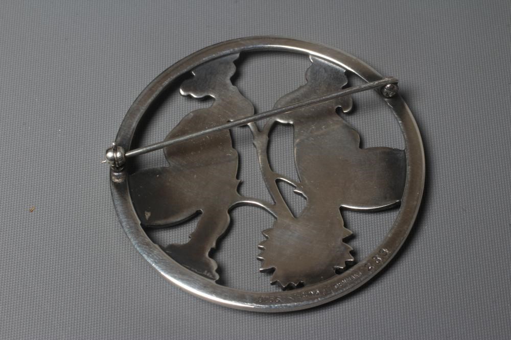 A GEORG JENSEN SILVER CIRCULAR MOONLIGHT BLOSSOM BROOCH designed by Arno Malinowski with two Image