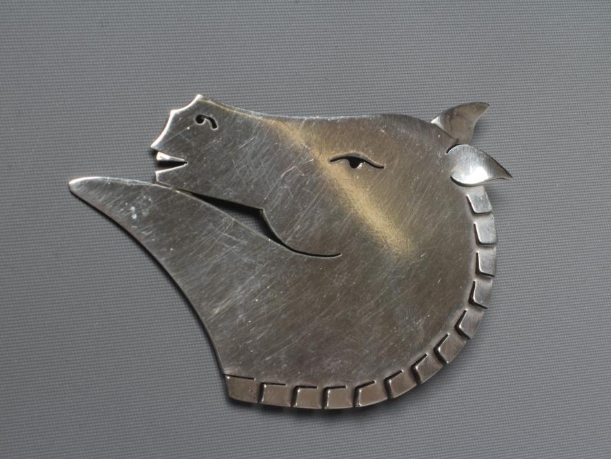 A GEORG JENSEN SILVER HORSE HEAD BROOCH designed by Arno Malinowski, stamped Sterling 90 (Est. plus Image
