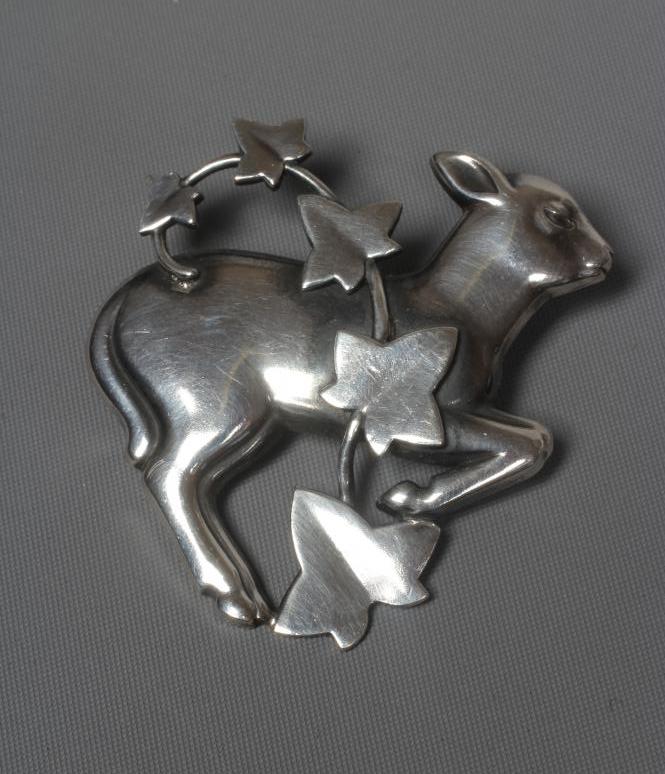A GEORG JENSEN SILVER BROOCH designed by Arno Malinowski as a lamb with a branch of ivy, stamped Image