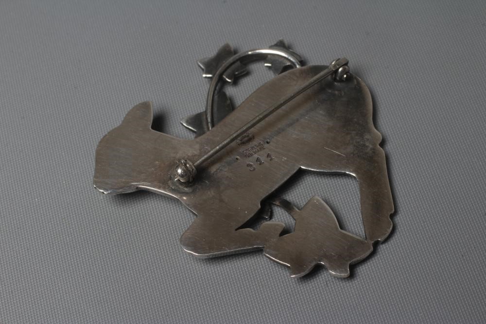 A GEORG JENSEN SILVER BROOCH designed by Arno Malinowski as a lamb with a branch of ivy, stamped Image